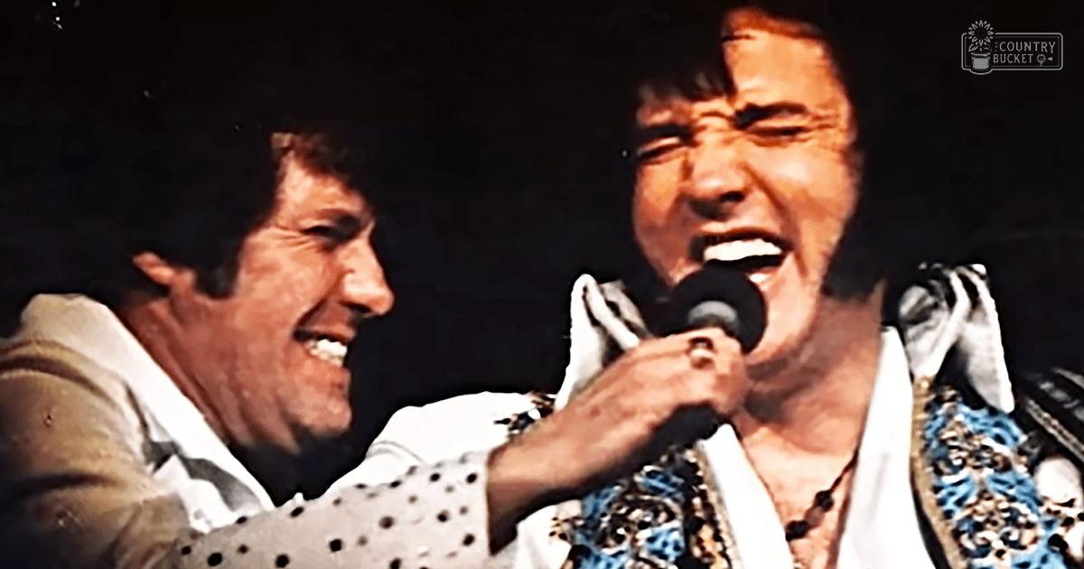 Middle-aged male performers in a musical performance scene with stage costumes and microphones.