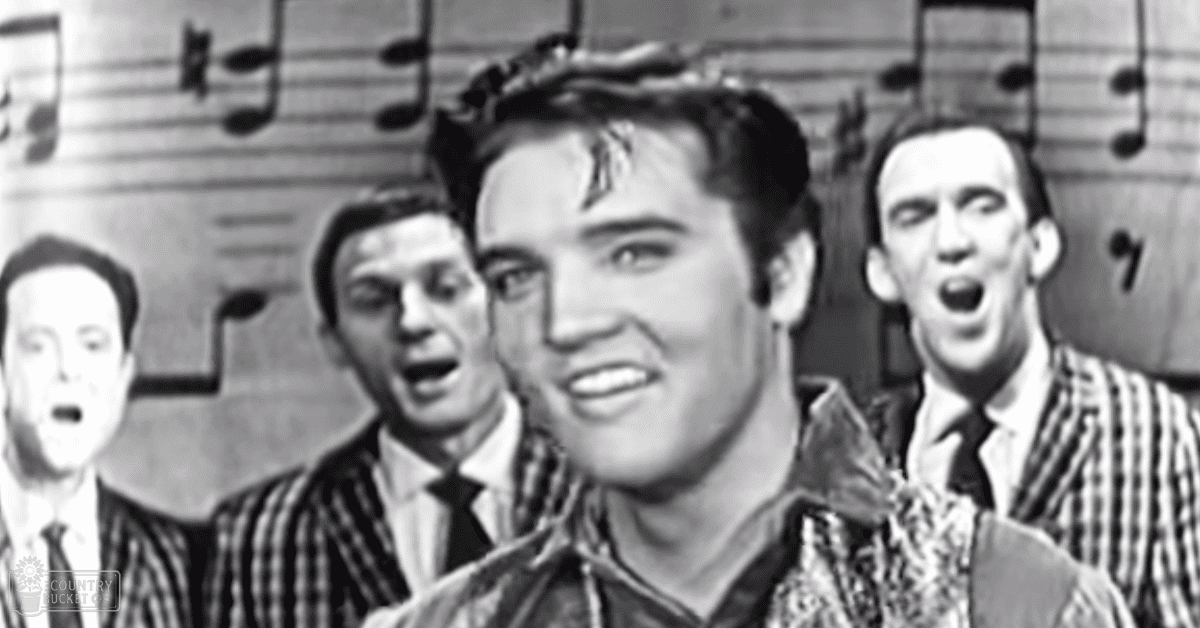 A group of young adult males performing on stage under well-lit conditions, with musical notes visible in the background.