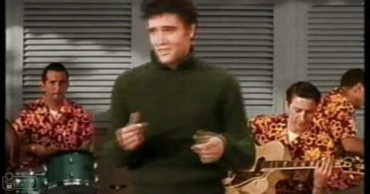 Young adults wearing casual mid-20th century clothing in an indoor setting with musical instruments visible; natural light through blinds suggests daytime, neutral tones dominate the palette.