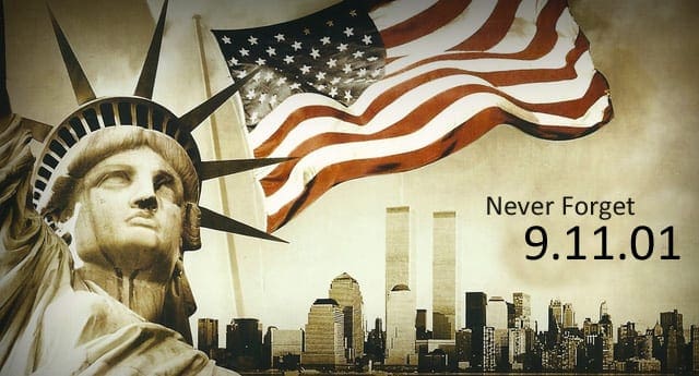 Statue of Liberty in New York City, partially obscured by an American flag, with 'Never Forget 9.11.01' text below the statue's silhouette and Twin Towers visible in the background.