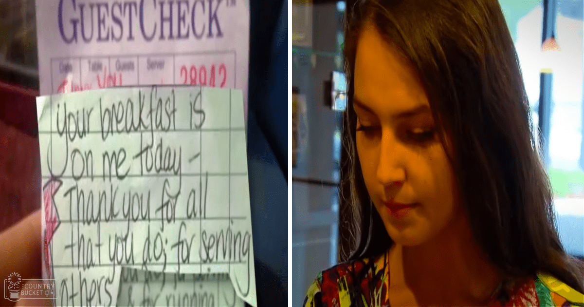 A young adult female wearing a colorful floral top indoors at what appears to be a restaurant, with a handwritten note on a guest check pad reading 'Your breakfast is on me today - Thank you for all that you do; for serving others.'