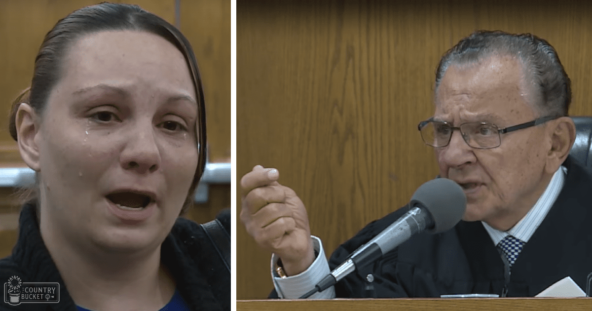 A young adult female in a courtroom setting with medium-length hair and a dark-colored garment under a blue inner layer; an older adult male judge wearing glasses, a black robe over a white collared shirt and checkered tie, seated at a desk with a microphone.