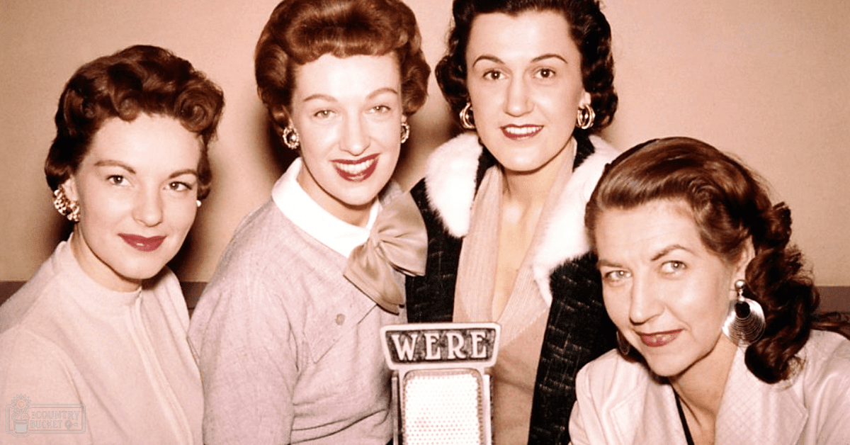 A group photo from the mid-20th century with four adult females in a studio setting.
