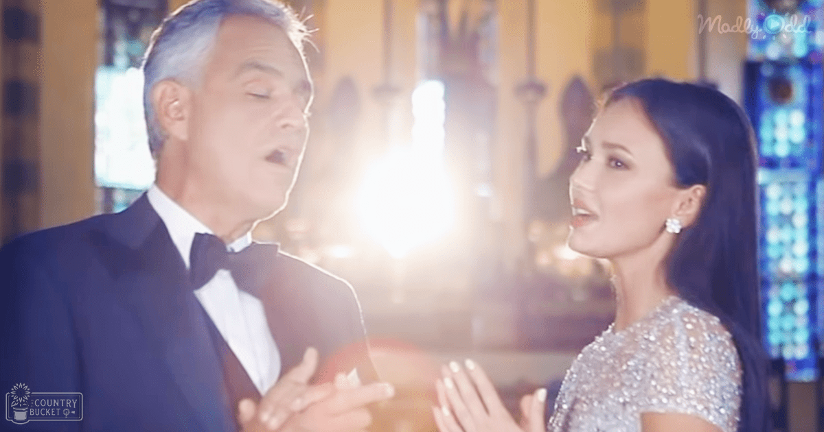 A middle-aged male in a dark tuxedo with a white shirt and black bow tie stands beside an adult female wearing a sparkly short-sleeved dress, likely at a formal event.