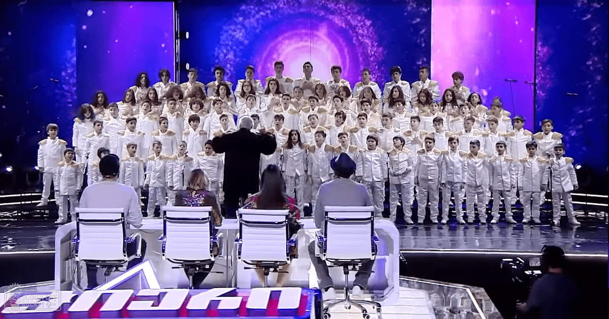 Full view of cchoir and judges wih conductor