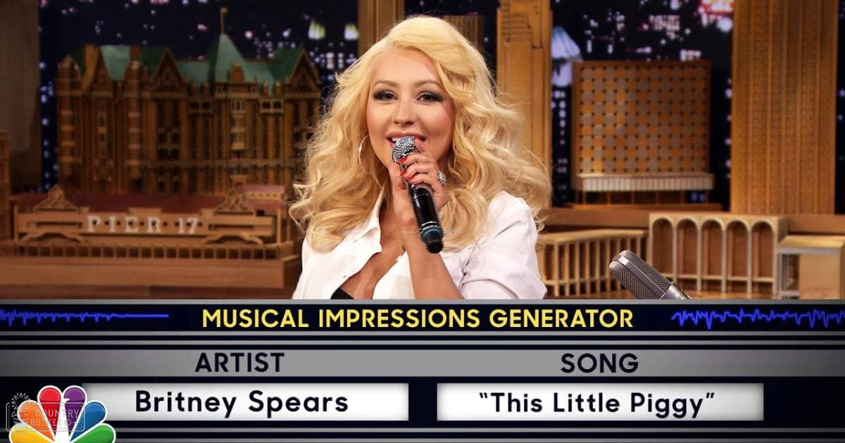 A female performer in a white blouse with short sleeves, holding a microphone against an indoor studio backdrop with cityscape at night. NBC logo and 'MUSICAL IMPRESSIONS GENERATOR' text on screen indicate a talk show or performance setting.