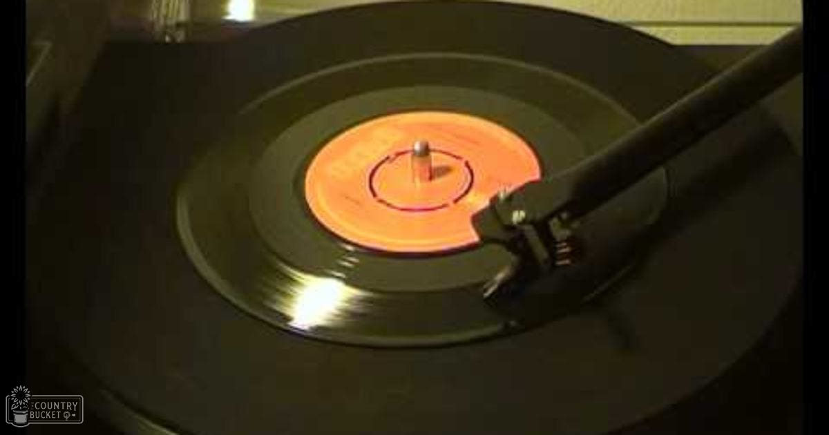 Indoor scene with a record player spinning a vinyl record, suggesting music playing.