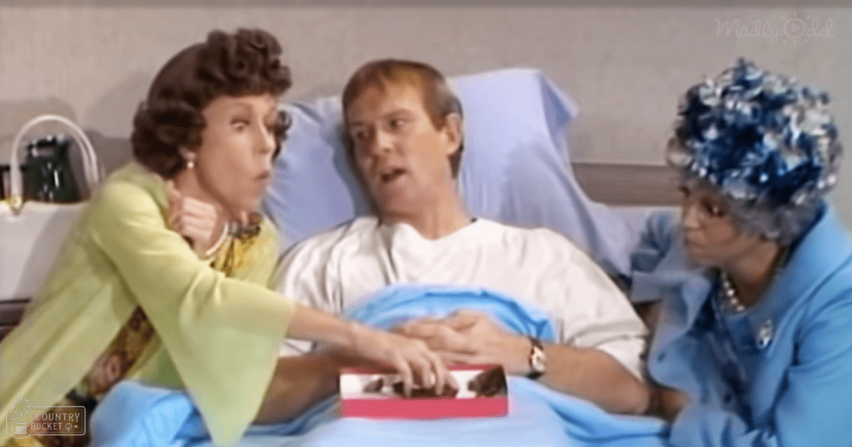 Three adult women seated in a hospital room with minimal decor, wearing dresses and suits.
