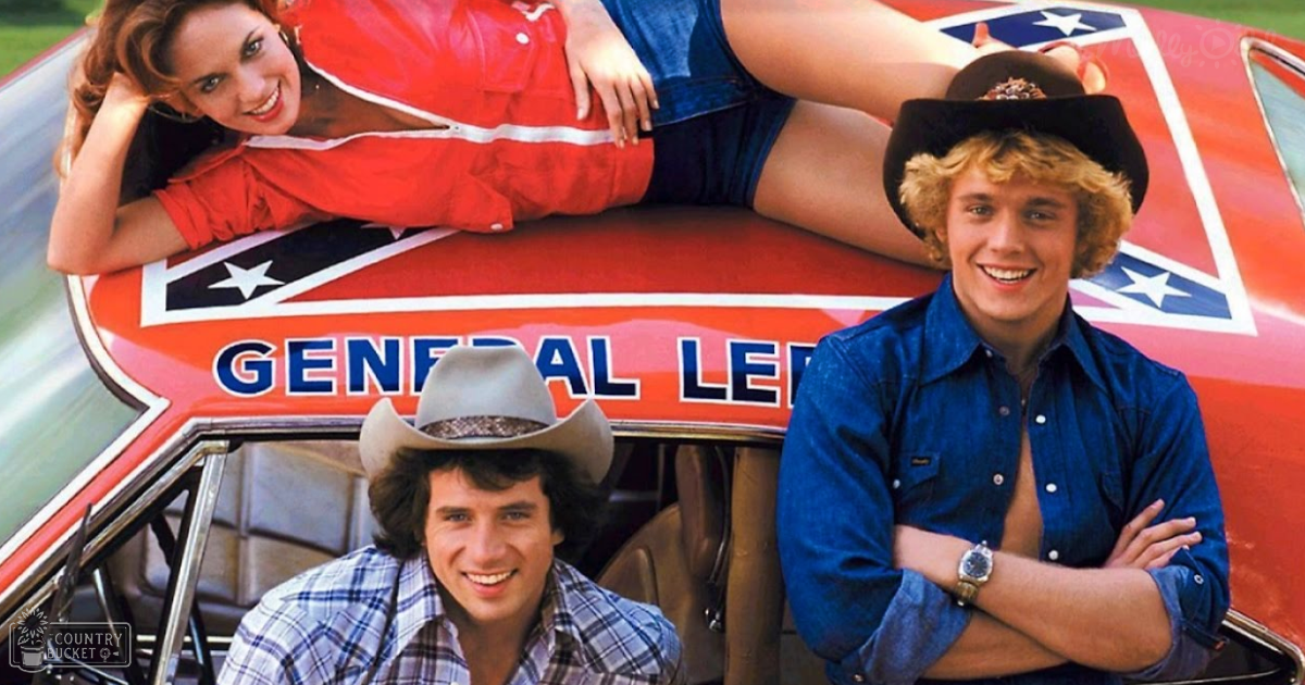 Young adult males and females in vintage 1970s attire lean on a car labeled 'GENERAL LEE' against an open rural backdrop, daytime setting.
