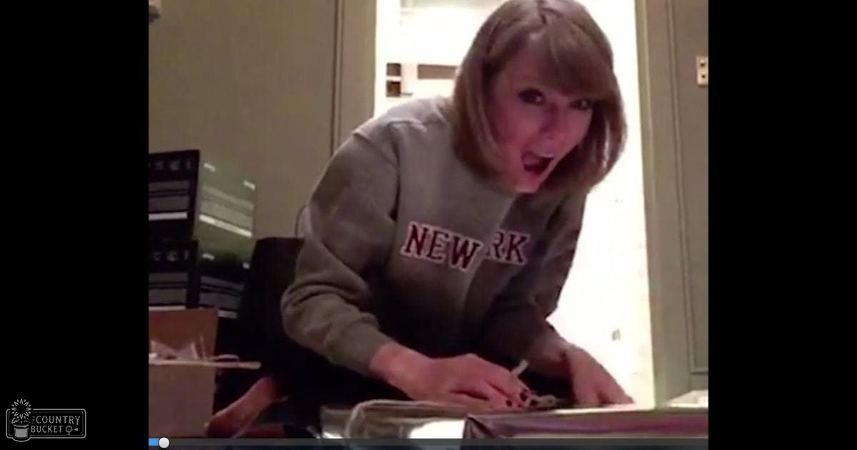 Young adult female wearing 'NEW YORK' sweatshirt indoors, natural light suggests daytime.