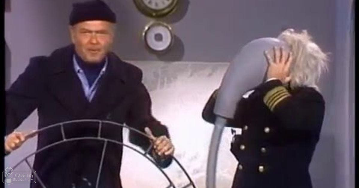 A maritime scene inside a ship's cabin, with two middle-aged to older adult men in formal attire. The setting includes nautical decor like a ship's wheel and analog clocks.