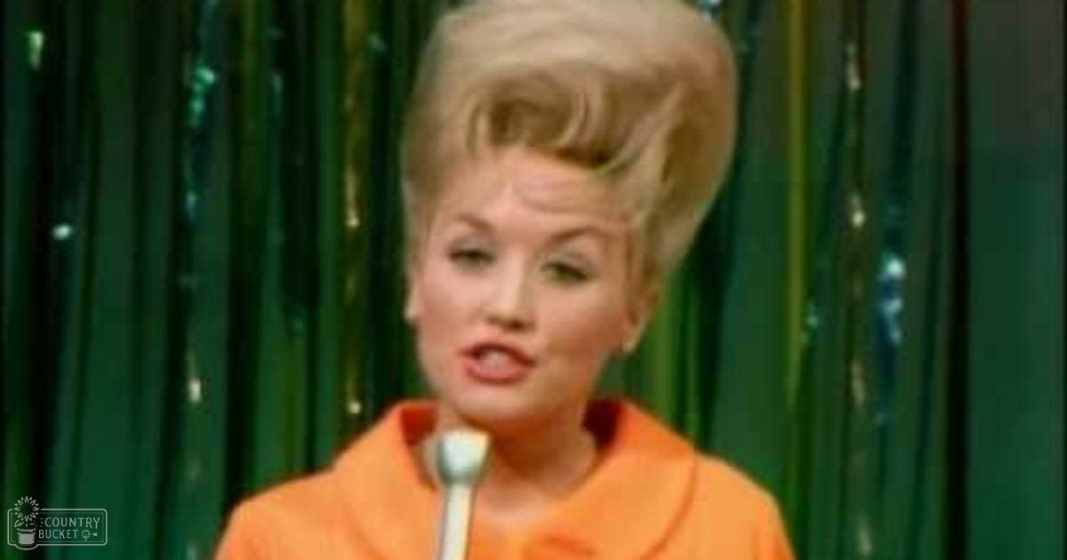 A woman, possibly an adult female singer, wears a bright orange dress or top on stage with green curtains in the backdrop. The scene suggests a performance setting from the mid-20th century.