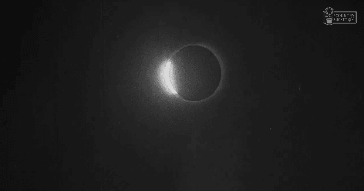 A total or annular solar eclipse with a dark night sky and a bright ring-like structure