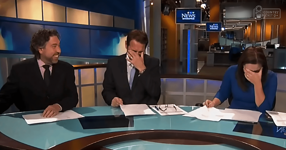 Three individuals seated at a news studio desk, wearing formal attire with microphones and broadcasting equipment in the background; indoor setting with blue backdrop and beige wall paneling.