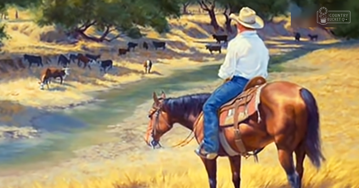 An adult male riding a brown thoroughbred horse near a river with cattle grazing in the background, set in an open field surrounded by trees during what appears to be late morning or early afternoon with greenery and scattered shadows.