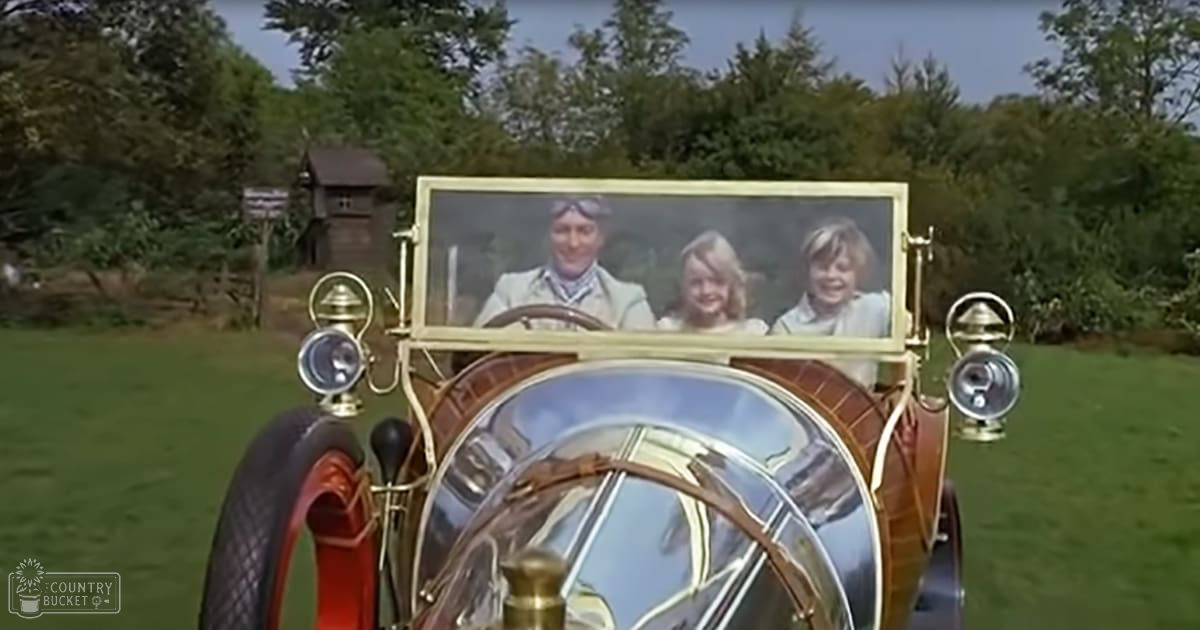 A vintage car with three passengers, set against a lush green rural landscape under bright sunlight.