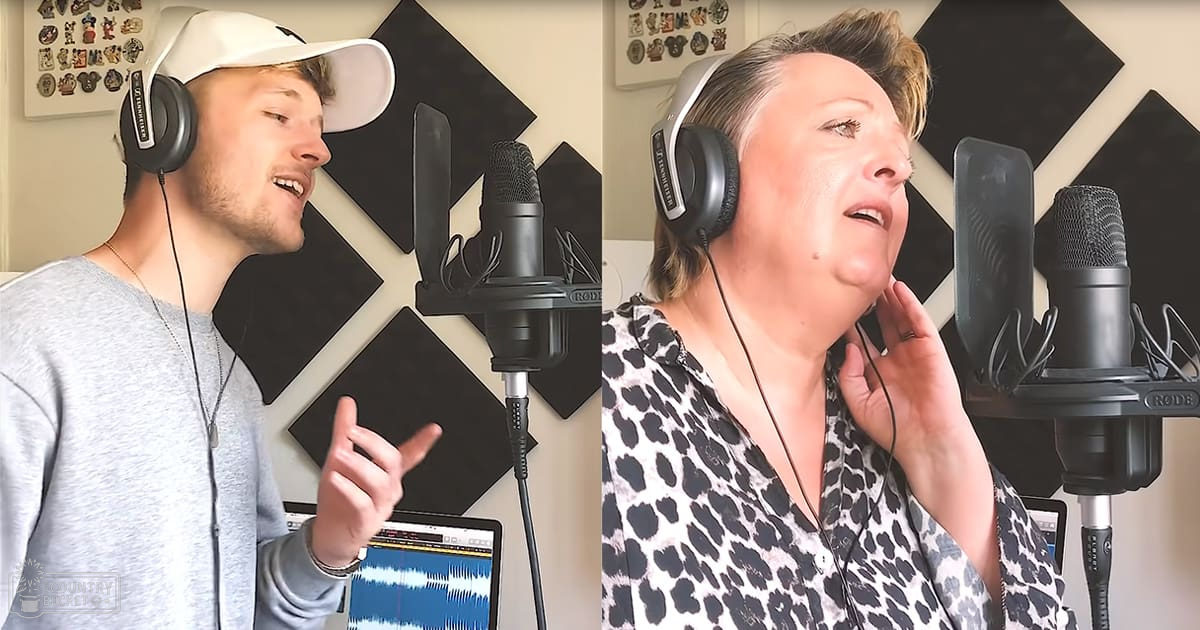 Indoor recording studio setup with two individuals; young adult male in a gray zip-up hoodie and middle-aged to older adult female in a black and white leopard print blouse, both wearing headphones. Setting includes soundproofing panels and framed pictures.