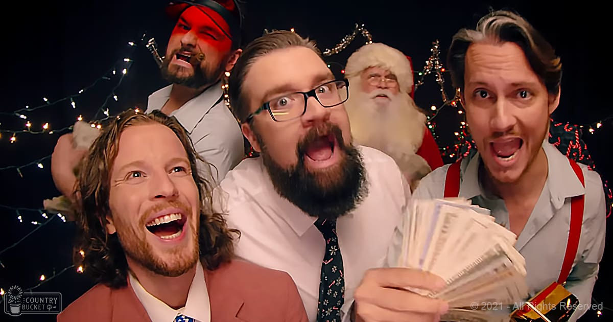 A festive indoor gathering of adults in holiday attire, possibly during Christmas time.