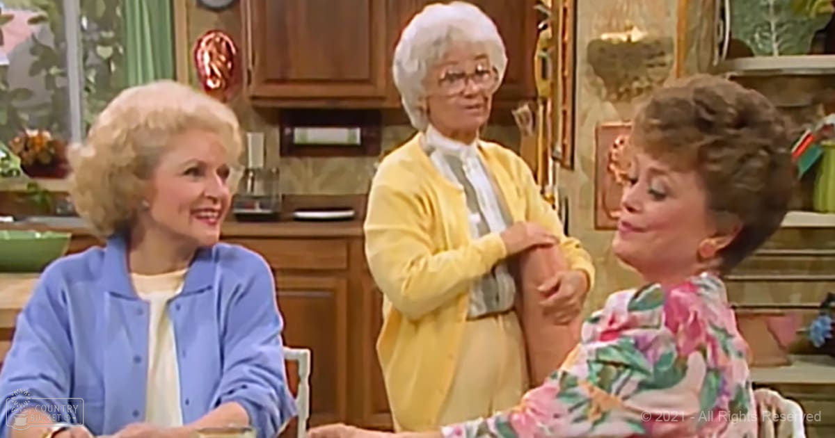 Adult female in light blue button-up shirt, older adult female in yellow cardigan, young adult female in floral top; interaction scene set in a cozy kitchen with wooden cabinets and plants.