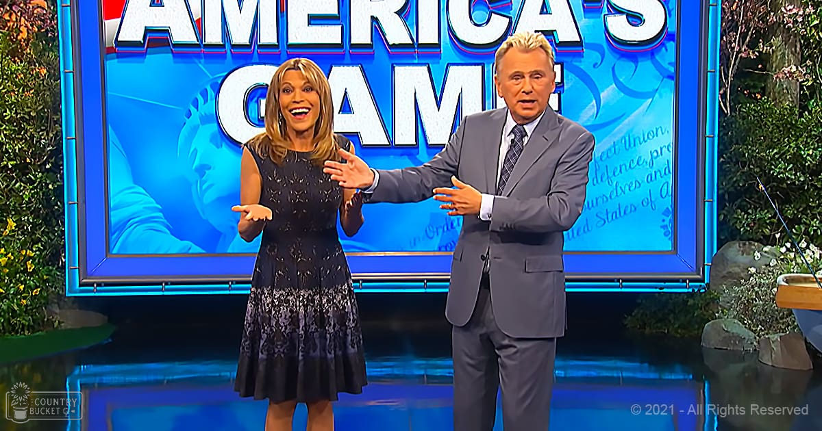 Indoor television studio set for 'America's Game' with a large screen displaying the show's title and decorative greenery on both sides, under professional lighting.