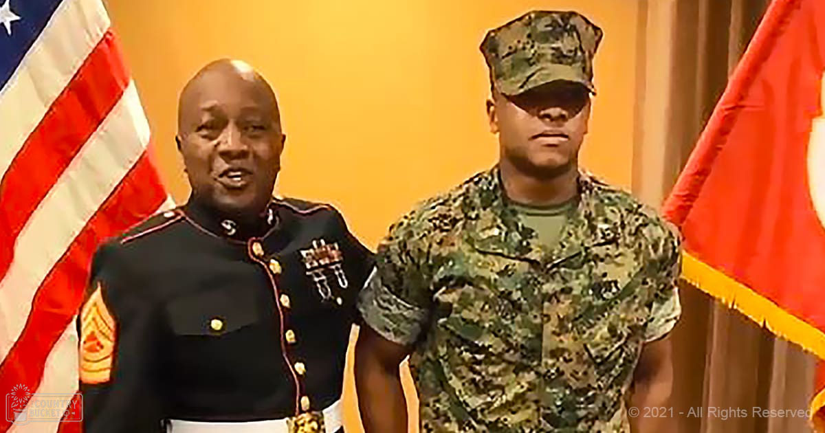 An awards ceremony in a military setting with two adults, one wearing a formal U.S. Marine Corps dress uniform and another in camouflage attire.