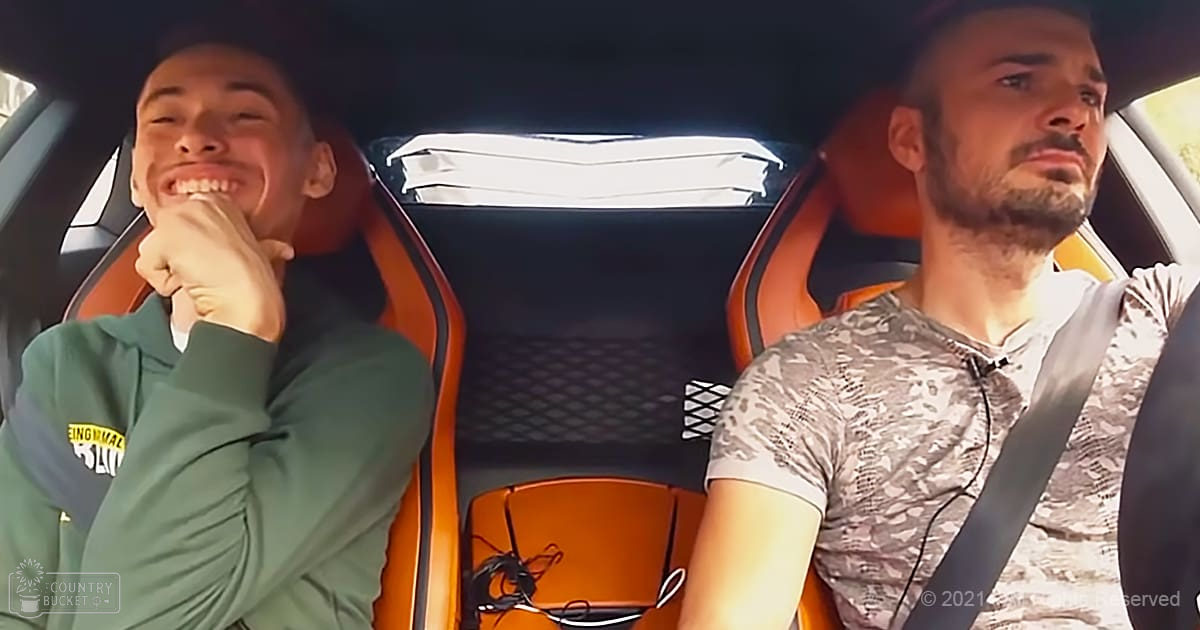Two individuals inside a car, wearing casual clothing and accessories in natural daylight.