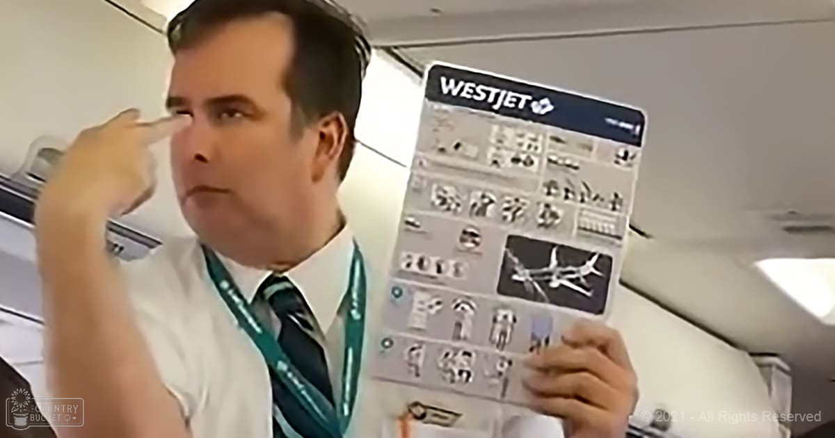 An adult male in a WestJet airplane cabin wearing a white dress shirt, dark tie, and lanyard, holding an informational safety card with the WestJet logo visible.