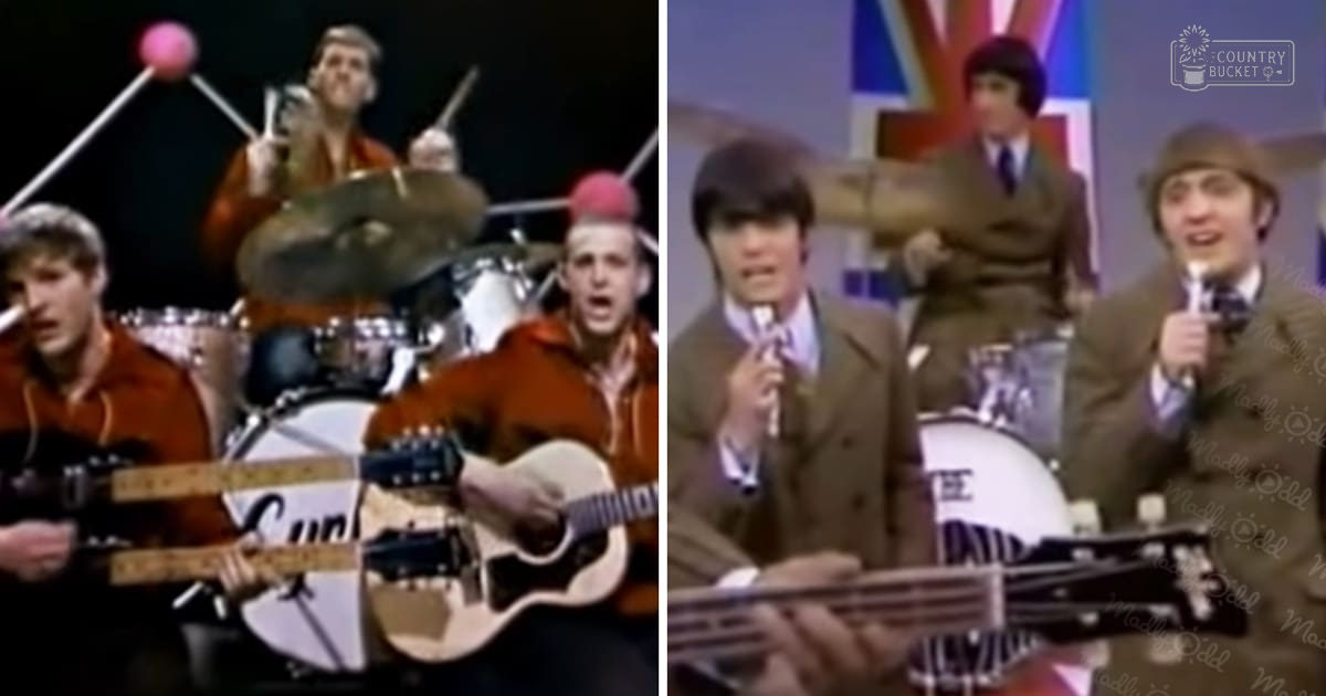 Musicians in 1960s-style orange and brown jackets perform on stage; a drum set is visible behind them.