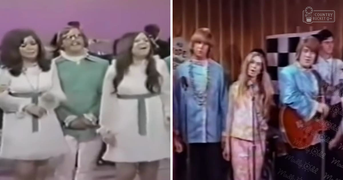 A musical performance scene with children in white dresses and young adults holding guitars, set against a backdrop with simple stage lighting from the 1960s-1970s.