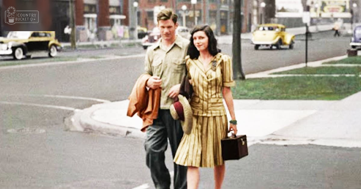 A couple in an urban mid-20th-century setting, wearing vintage clothing; spring or summer day with clear visibility.