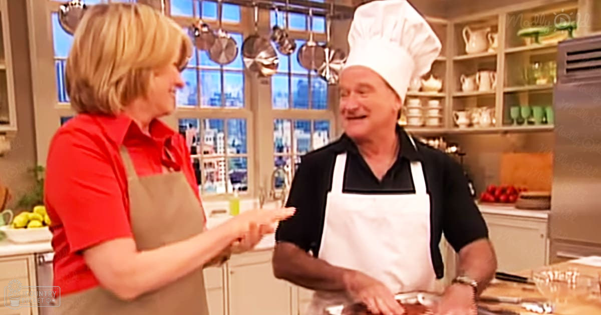 Two older adults in a well-lit indoor kitchen scene with red, white, and beige colors during daytime or early evening.