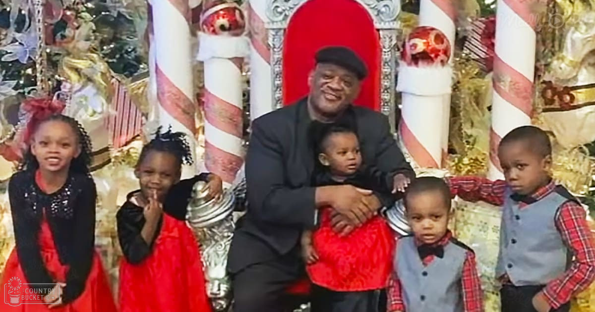 A festive scene with a man and children in front of Christmas decorations, including an ornate throne-like chair.