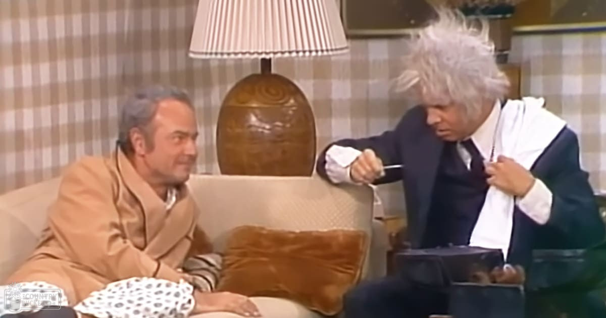 A mid-20th-century living room scene with two men in suits, beige sofa and plaid wallpaper, warm indoor lighting.