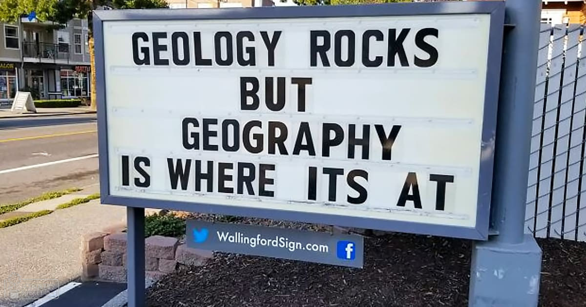 A signboard reading 'GEOLGY ROCKS BUT GEOGRAPHY IS WHERE ITS AT' in Wallingford, Connecticut.