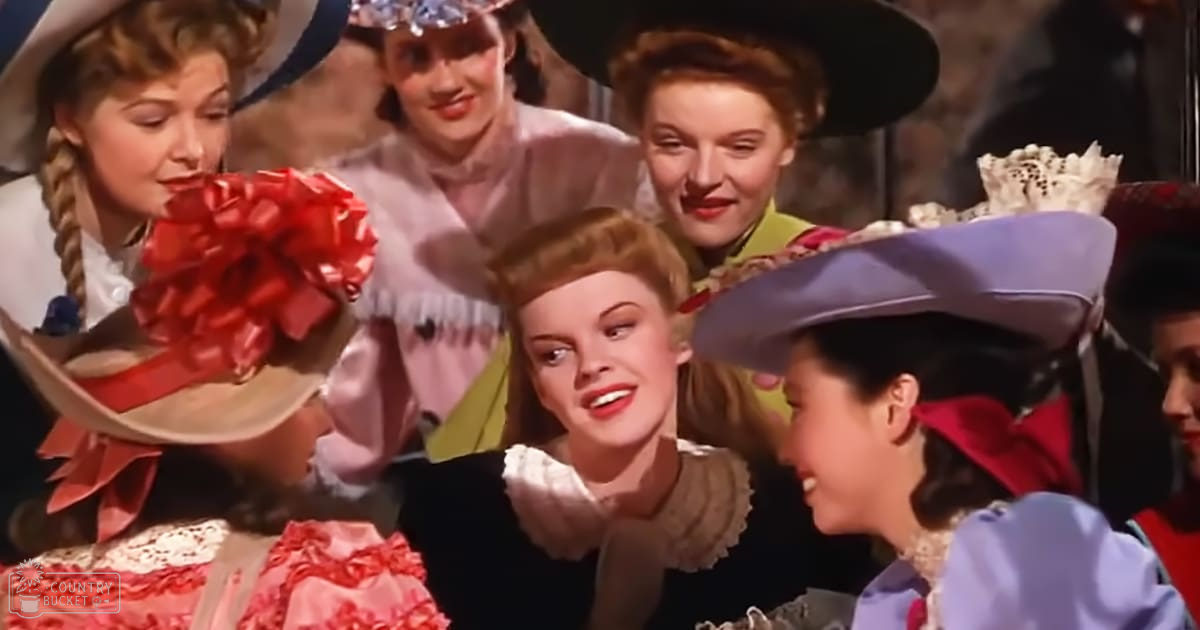 A group of women in vintage-style clothing at what appears to be a theatrical or celebratory event, possibly from the mid-20th century.