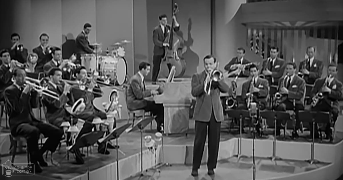 A mid-20th-century jazz band performing in a studio setting with musical instruments and professional lighting.