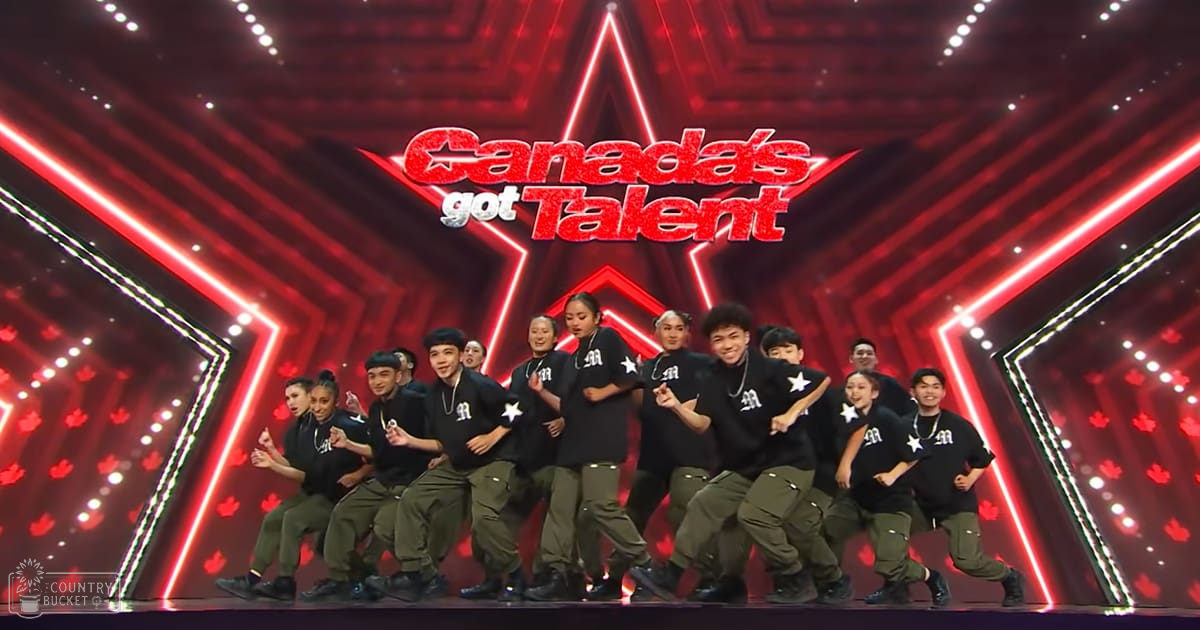 A dance group performs on a star-shaped stage with red lighting and maple leaf motifs, Canada's Got Talent backdrop in red and white.