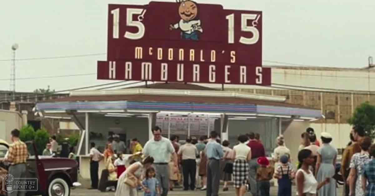 A mid-20th century vintage McDonald's restaurant scene with children in white dresses and adults wearing plaid shirts, gathered around the iconic sign on a sunny summer day.