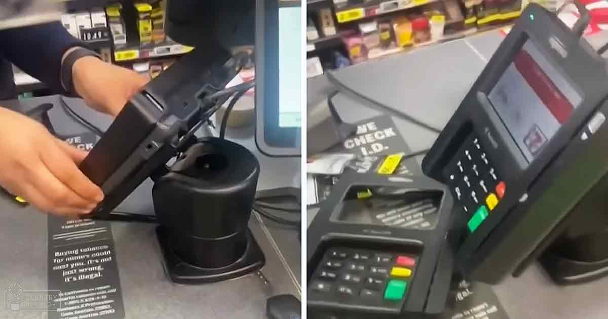 An adult female at a retail store checkout counter interacting with payment terminal; 'WE CHECK I.D.' sign visible.