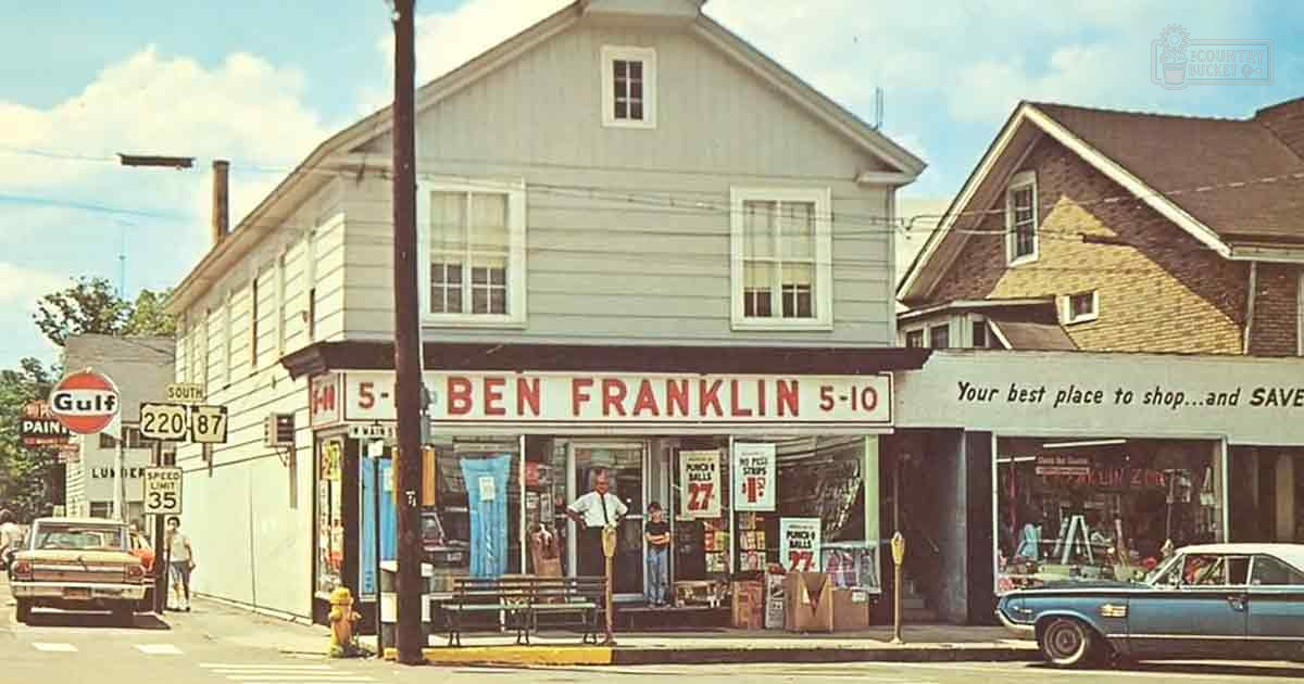 An adult male in a white shirt and dark tie stands on the sidewalk near a 'Ben Franklin 5-10' store, with a child nearby. A vintage car is parked outside.