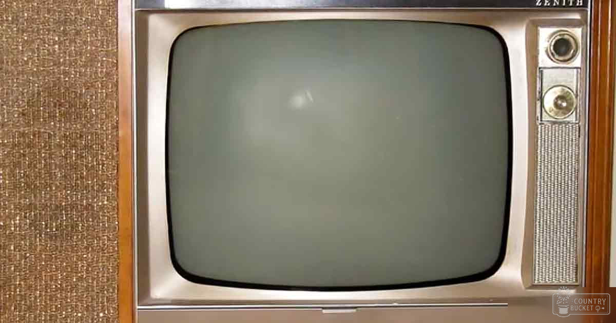 An old-fashioned Zenith television with a wooden cabinet, set indoors in what appears to be someone’s living room or entertainment area.