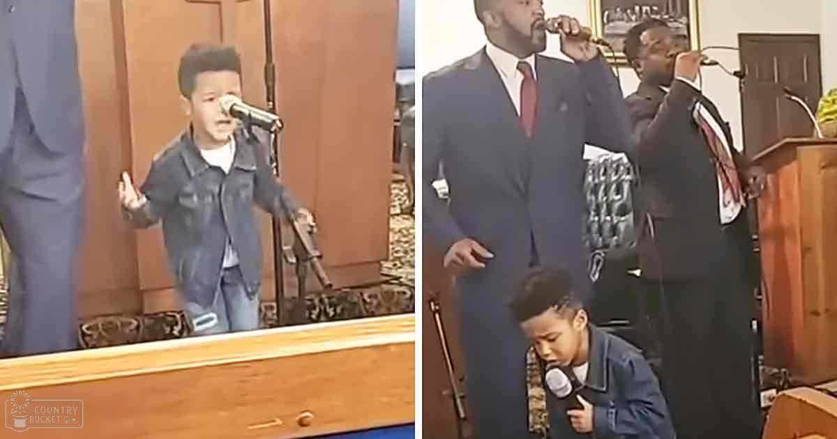 A young boy singing into a microphone in what looks like a church setting with two adult males in formal attire. The scene is indoors with natural light coming from outside.