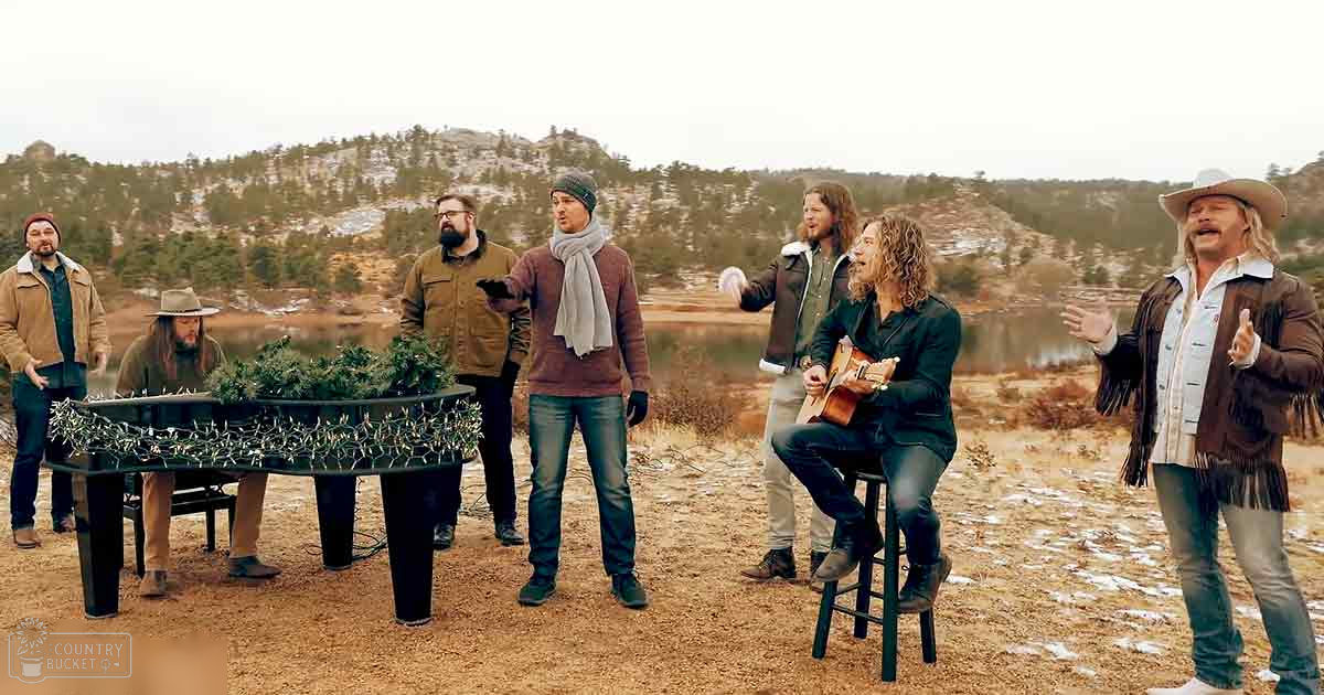 Musicians performing outdoors in a snowy, natural setting with earthy tones and soft daylight.