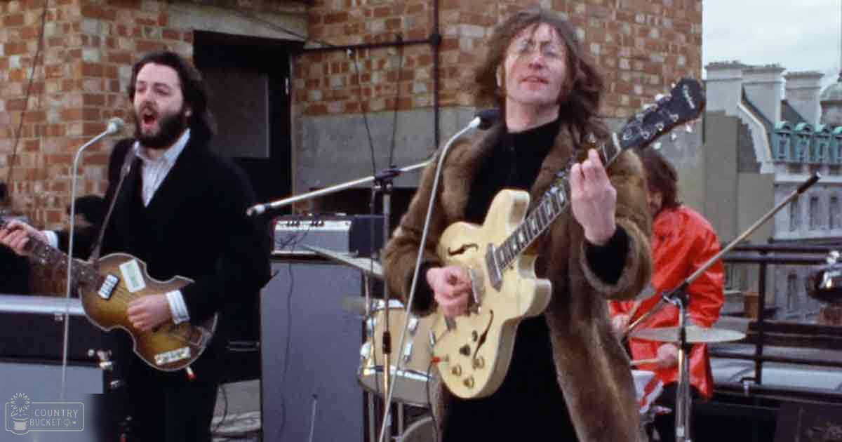 A rooftop performance scene with band members performing, brick walls and urban setting visible, daytime light, urban landscape, brick wall background.