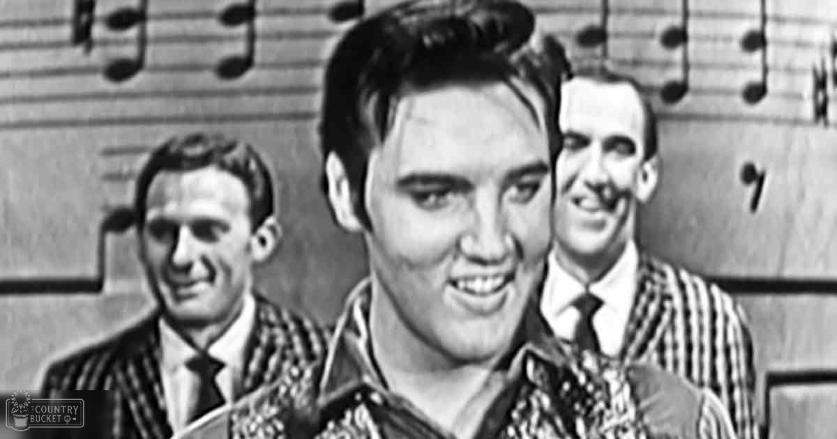 Young adult males dressed in patterned shirts with ties, possibly at a performance event indoors with musical notes on sheet music as part of the backdrop.