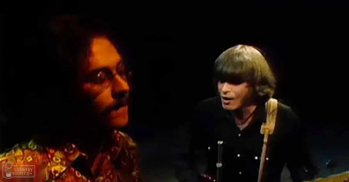 A musical performance scene with two male performers on a dimly lit stage at night.
