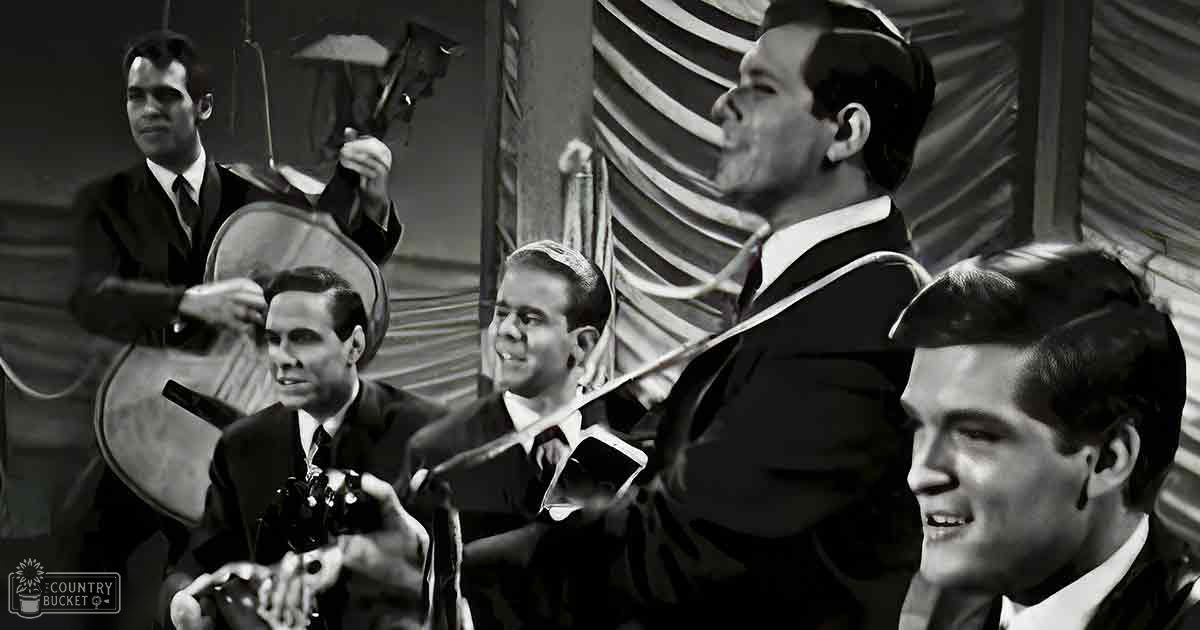 Musical ensemble in an industrial setting, possibly mid-20th century.