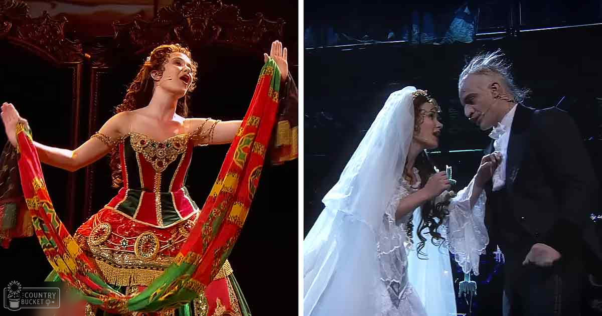 A young adult female in an ornate red dress with gold accents and green trimmings holds a colorful scarf, while a middle-aged male in a black suit and veil portrays the Phantom of the Opera on stage.