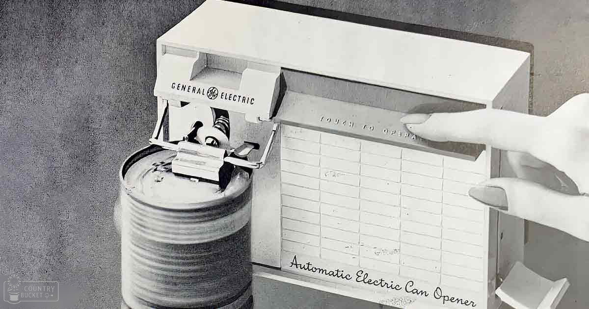 A General Electric Automatic Electric Can Opener with a rectangular shape, white color, and a handle for operation, mounted on a kitchen wall.