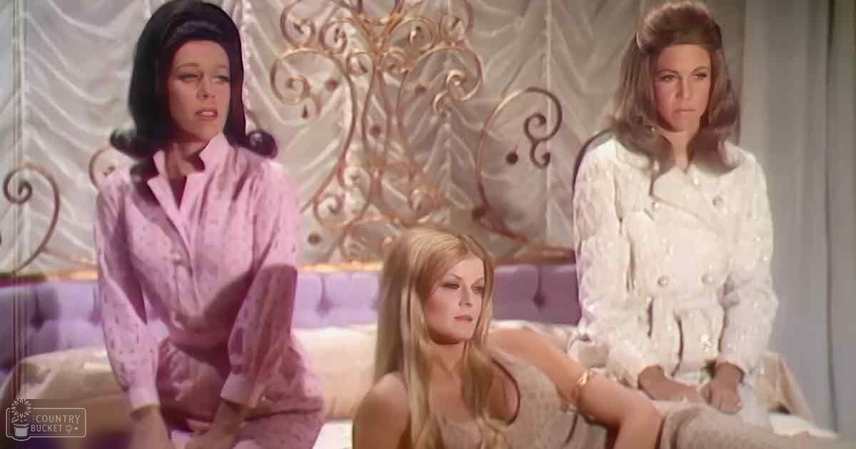 Young adult females in a cozy bedroom setting with ornate furniture and soft lighting.